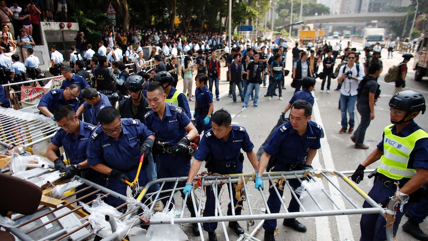 Hong Kong police break down barricades