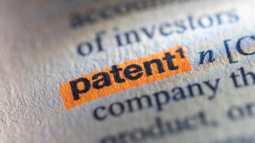 Close up of dictionary definition with the word "patent" highlighted in orange.