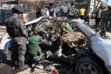 iraqi police examine remains of car bomb