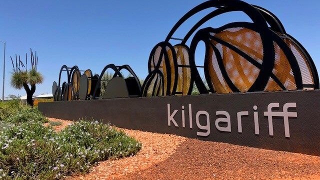 Steel sign, bearing the name Kilgariff, with black parabolas on the top as some form of public art