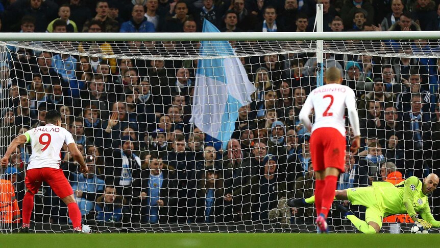 City keeper Willy Caballero (R) saves Champions League penalty from Monaco's Radamel Falcao.