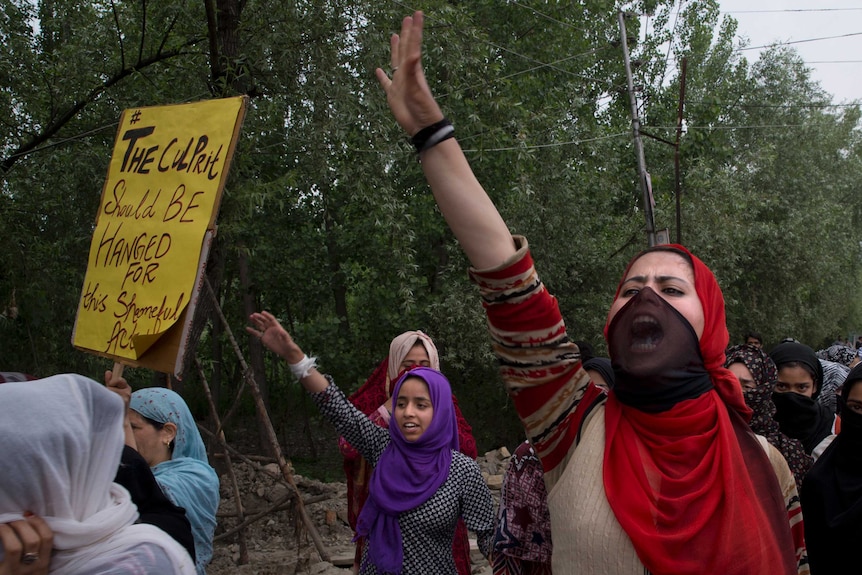 Kashmiri women shout slogans during a protest against the alleged rape of a three year old girl from north Kashmir at Mirgund.