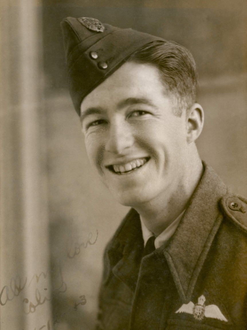 An old official sepia photograph of a young man in military uniform.