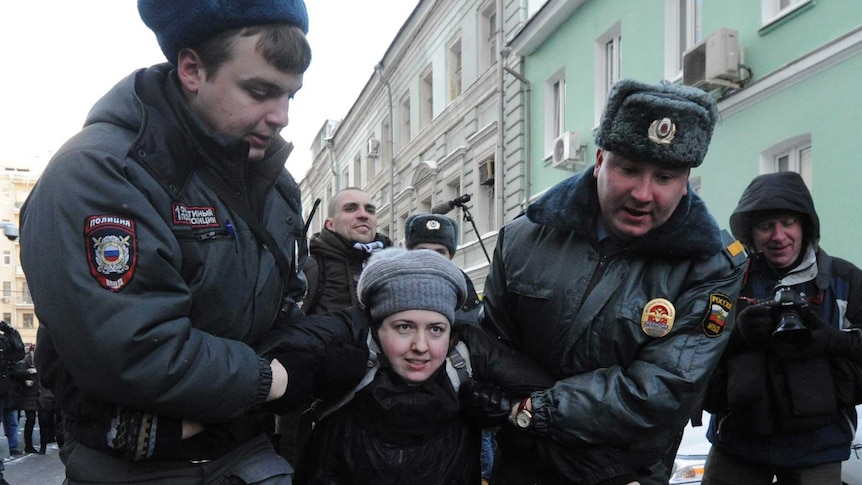 A gay rights activist is detained during a protest outside Russia's State Duma on January 25, 2013.