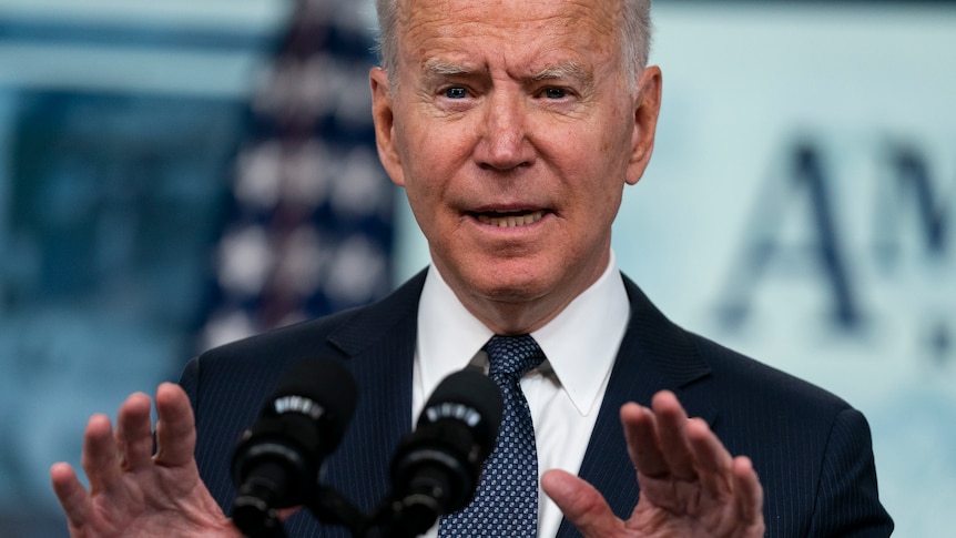 US President Joe Biden gestures as he speaks during an event