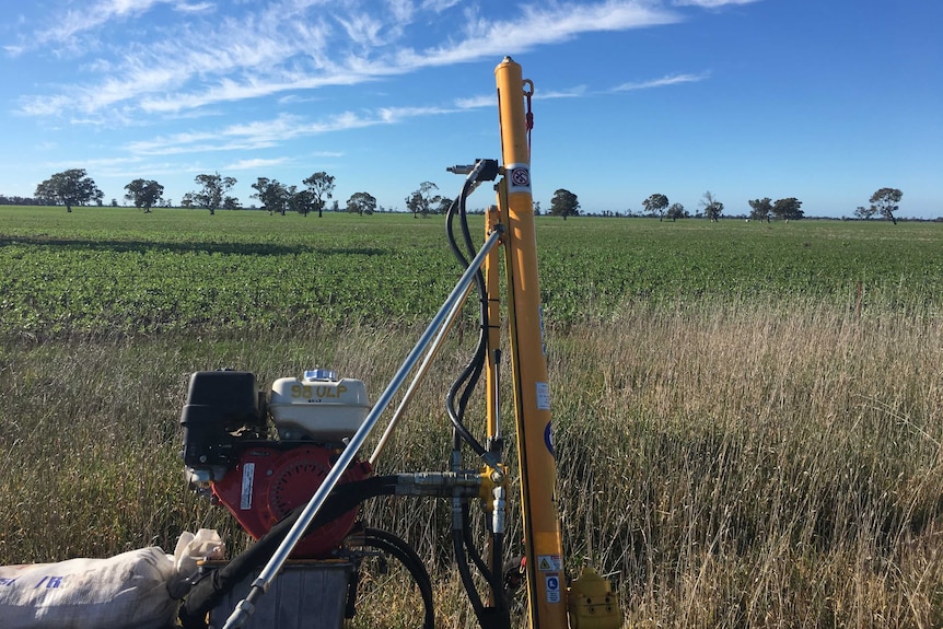 A soil testing rig stands in front of a cropping paddock in western Victoria