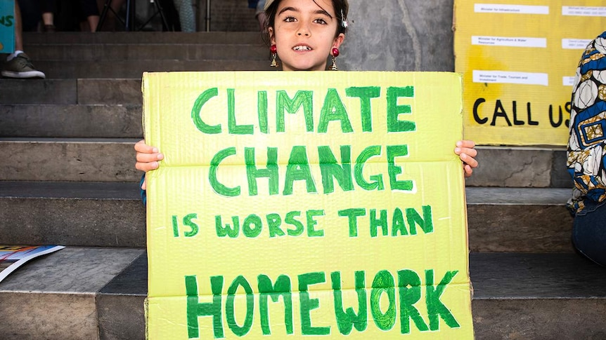 Year 3 student Charlie from Sydney joints climate protest in Adelaide