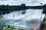 Water covering tennis courts in Mildura.