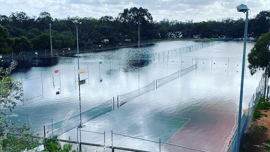 Water covering tennis courts in Mildura.