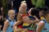 Erin Phillips pumps her fist after kicking a goal for Adelaide against Carlton in their AFL Women's clash.