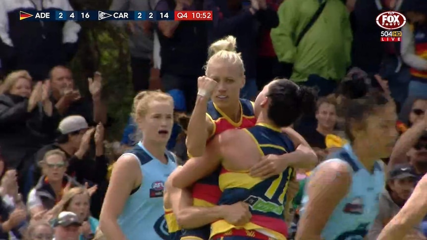 Erin Phillips pumps her fist after kicking a goal for Adelaide against Carlton in their AFL Women's clash.