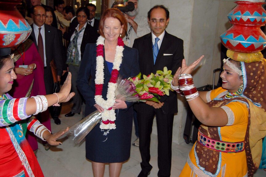 Julia Gillard is given a traditional Indian welcome as she arrives at her hotel in New Delhi.