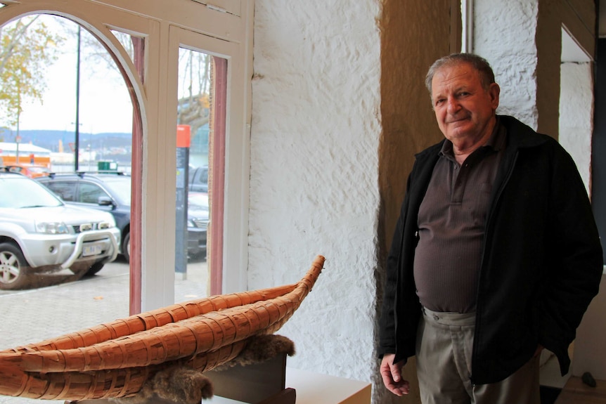 Rex Greeno with a model bark canoe