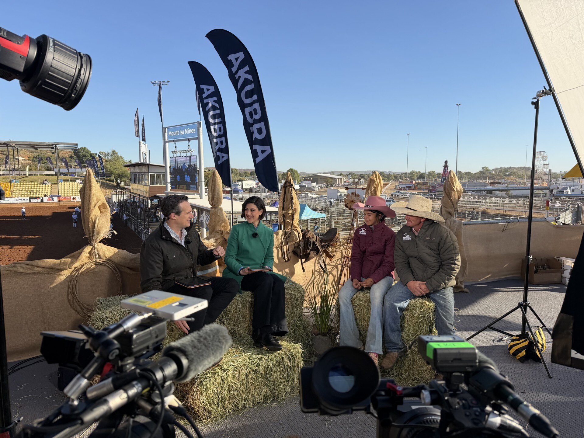 Photo of the ABC radio team broadcasting from the rodeo