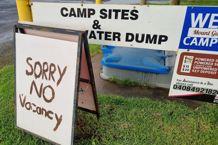 A no vacancy sign at the campsite.