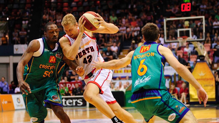 Crocodiles rocked ... Shawn Redhage (C) had 18 points for Perth on Sunday.
