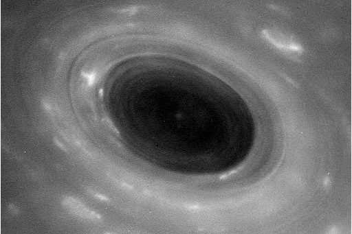 A black and white image of Saturn's atmosphere captured by NASA's Cassini spacecraft.