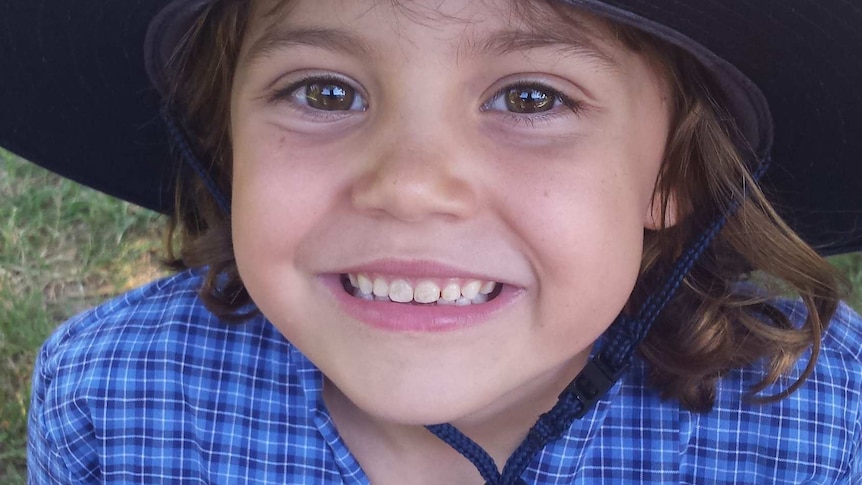 Sophie Mergler smiles for the camera in her school uniform