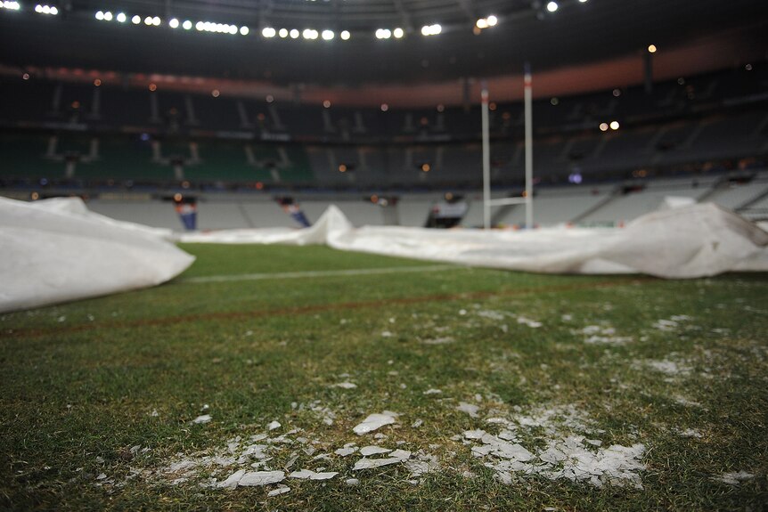 On ice ...the rock-hard frozen pitch prompted match officials to postpone the France-Ireland clash.