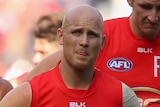 Gary Ablett and the Gold Coast Suns look dejected as they leave the MCG after losing to Melbourne