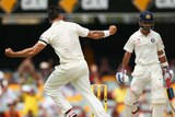 Mitchell Johnson celebrates the wicket of Ajinkya Rahane