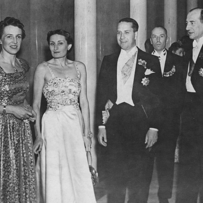 black and white photograph of a group of people in formal dress