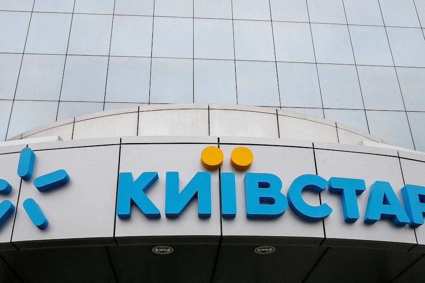 logo of kyivstar, written in cyrillic in blue with yellow dots