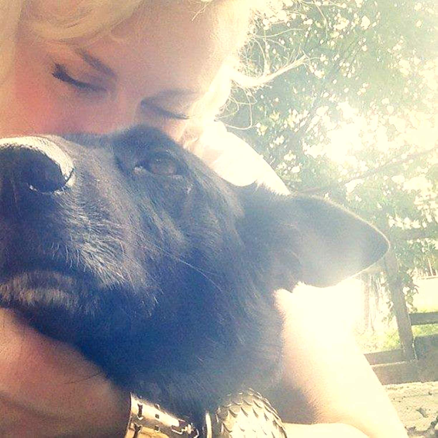 Jet (pet dog) and Michelle (owner) take a selfie to depict the love between a pet and owner.