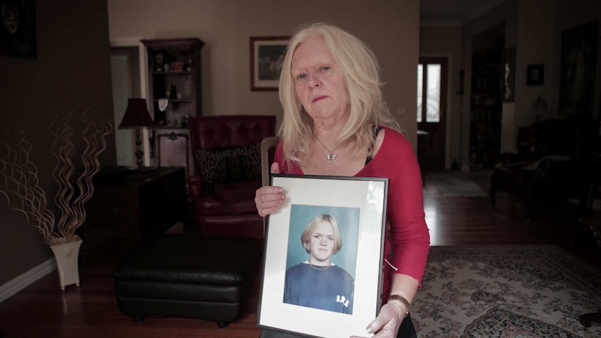 Carolyn Loughton with a photograph of her daughter, Sarah Loughton