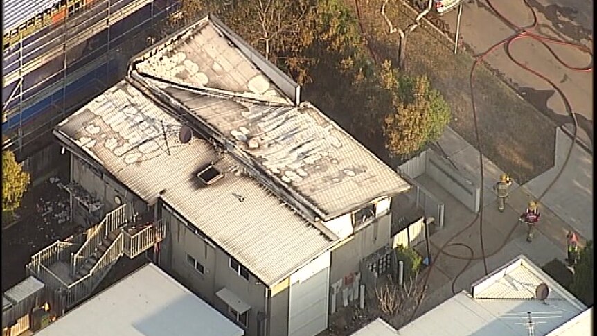 An aerial shot of unit block mostly gutted by fire.