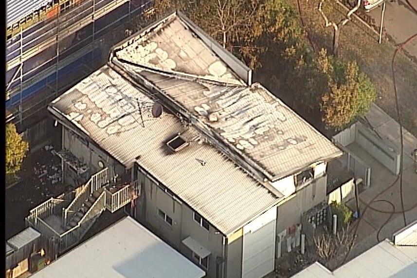 An aerial shot of unit block mostly gutted by fire.