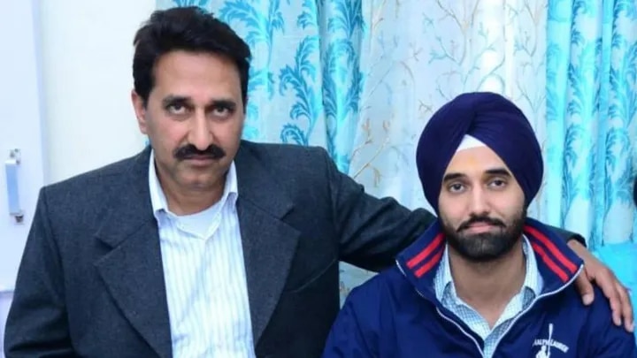 Gurjinder Singh with his arm around Dharmvir Singh. 