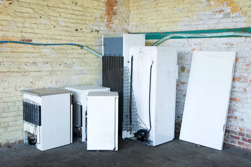 Group of discarded refrigerators
