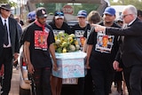Pallbearers carry Cleveland Dodd's casket at the teenager's funeral.