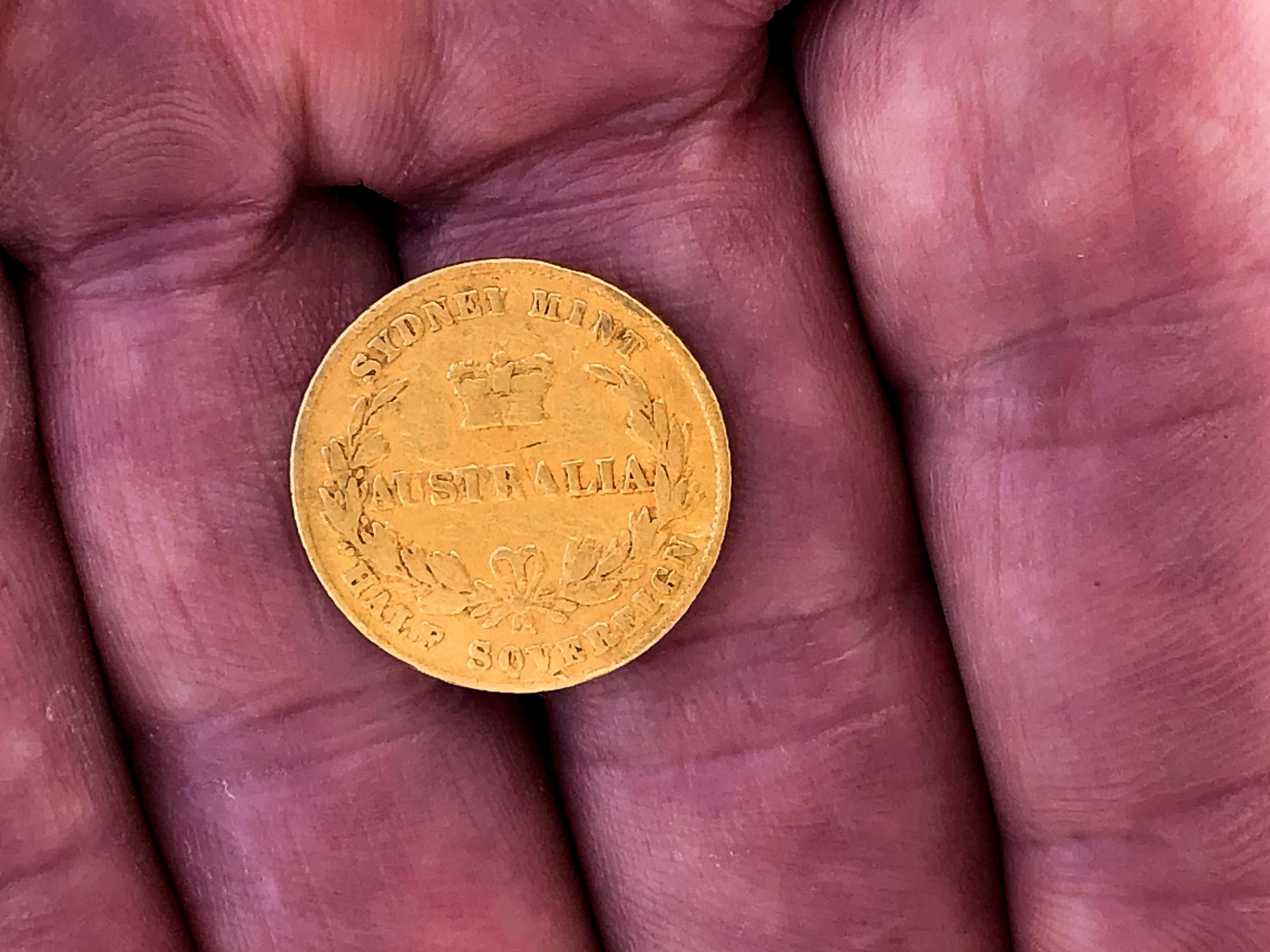 A close up on a gold half sovereign