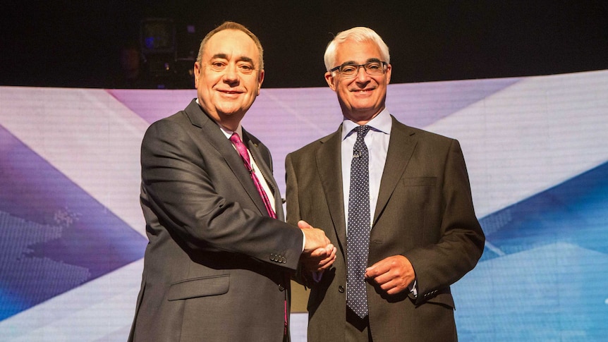 Alex Salmond (L) shakes hands with Alistair Darling (R) ahead of the debate on Scottish independence