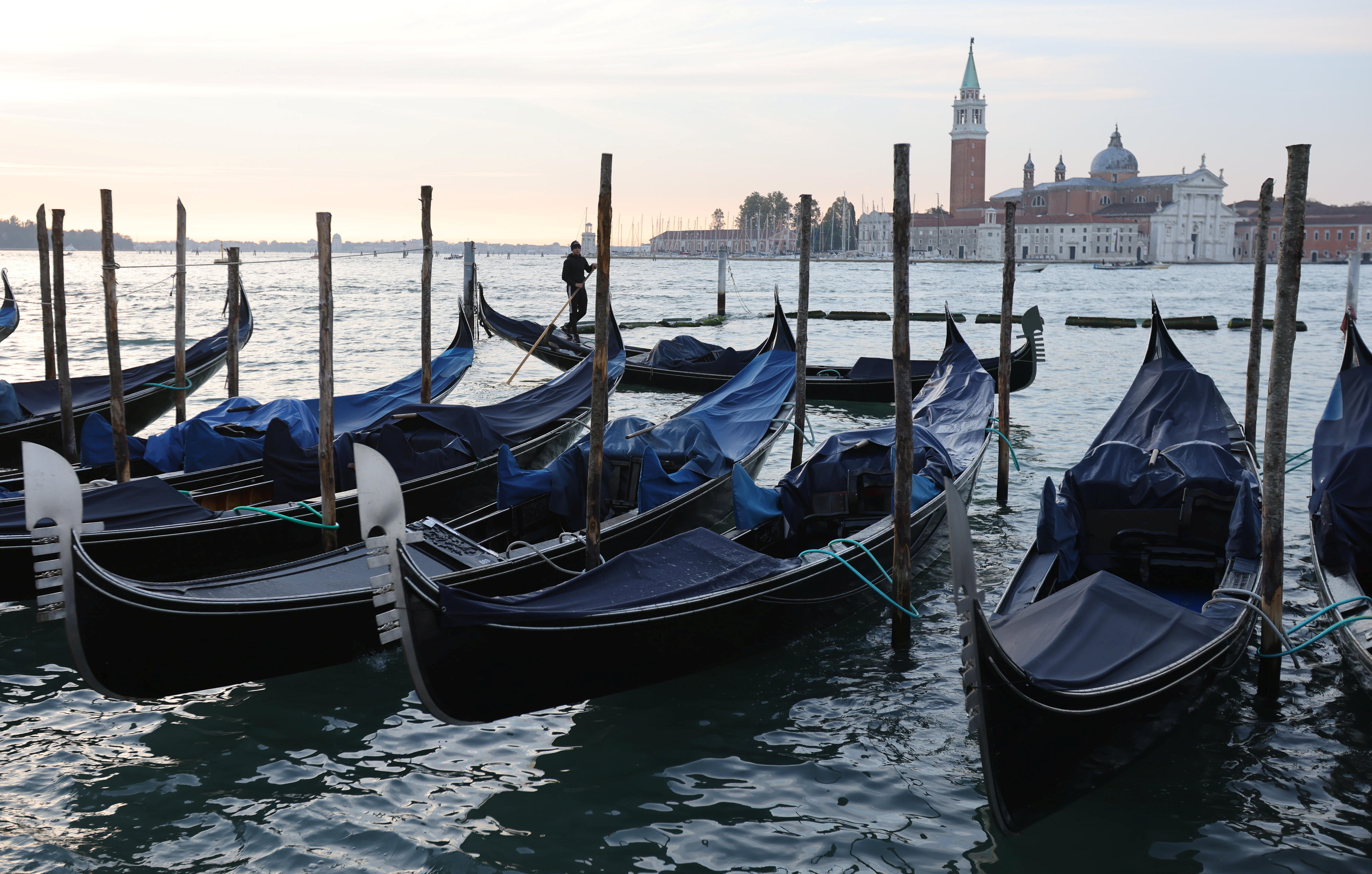 Gondolas docked in the foreground, with San Giorgio Maggiore island in the background