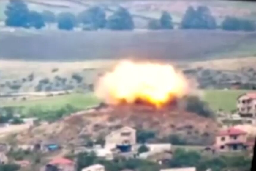 A large explosion on a hill in Karabakh.