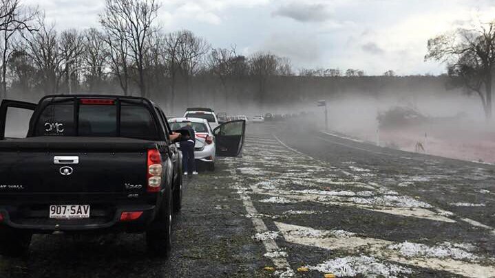 Cars lined up on road after a hail storm at Coolabunia, between Nanango and Kingaroy in southern Queensland.