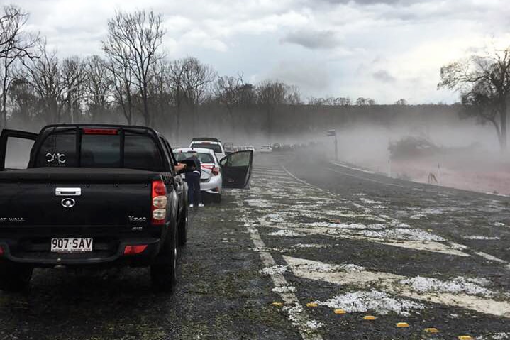 Cars lined up on road after a hail storm at Coolabunia, between Nanango and Kingaroy in southern Queensland.