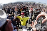 Kelly Slater in front of a huge crowd after winning his 11th world title