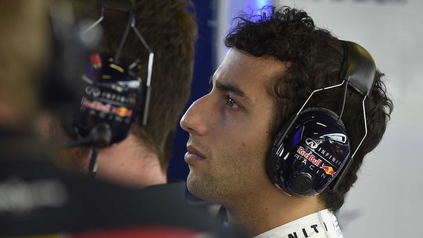 Ricciardo looks on in the Red Bull pits