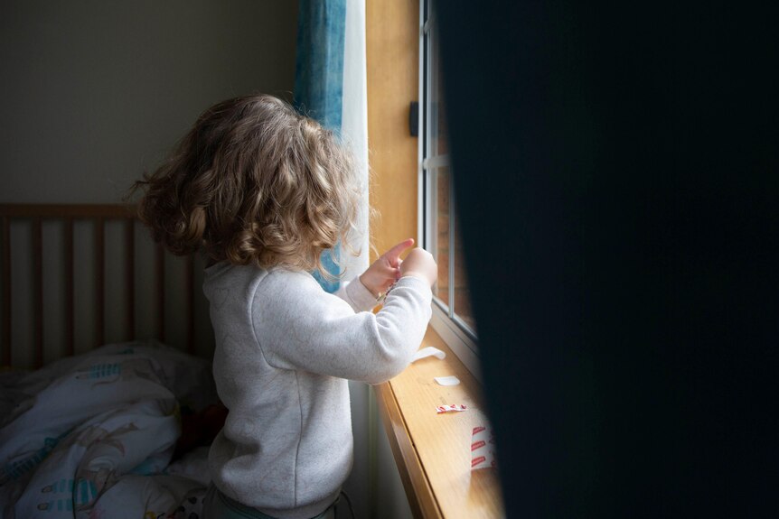 A child looking out of the window.