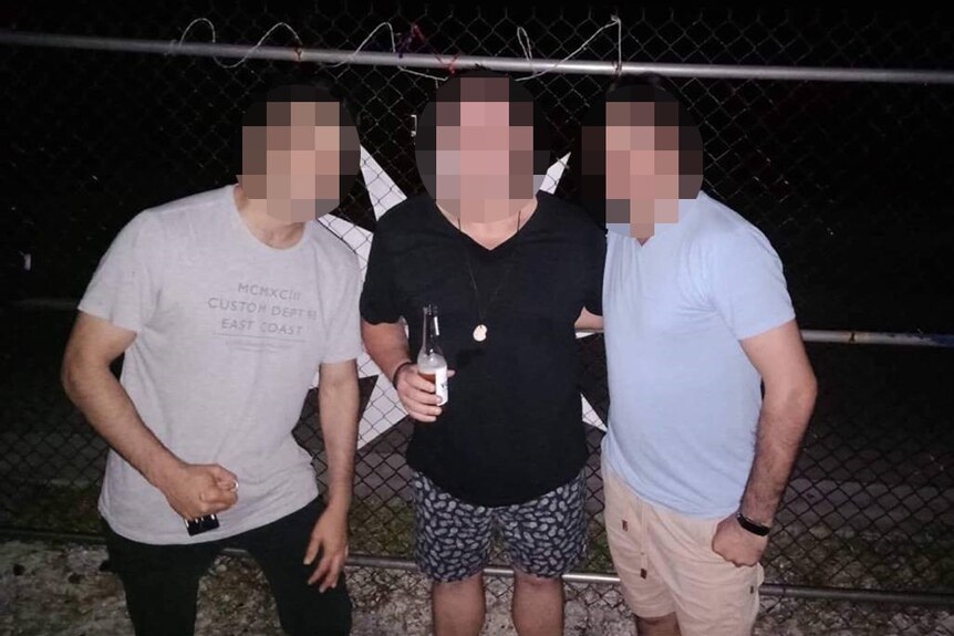 Pixellated image of Jamal, who has been granted refugee status, with two other men.