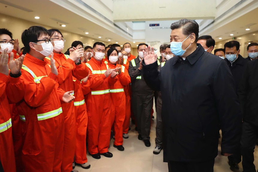 Chinese President Xi Jinping visits a factory.