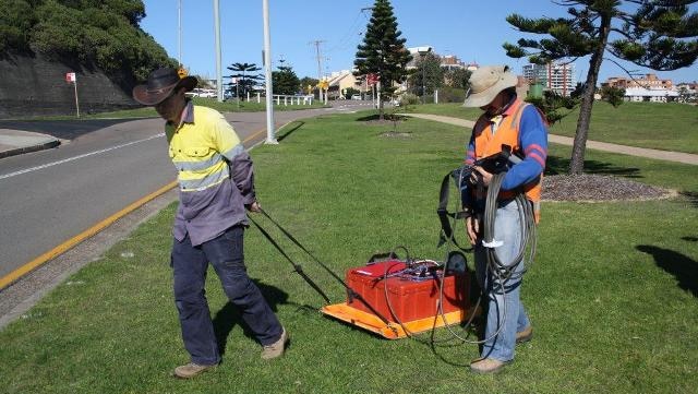 Val Donazzolo (right) from GBG Australia operating a ground penetrating radar in search of Newcastle's Macquarie Pier.