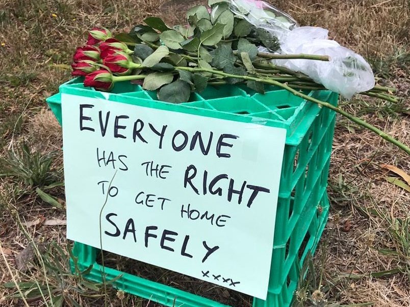 A milk crate is seen with the sign "Everyone has the right to get home safely" at the site Aiia Maasarwe's body was found.