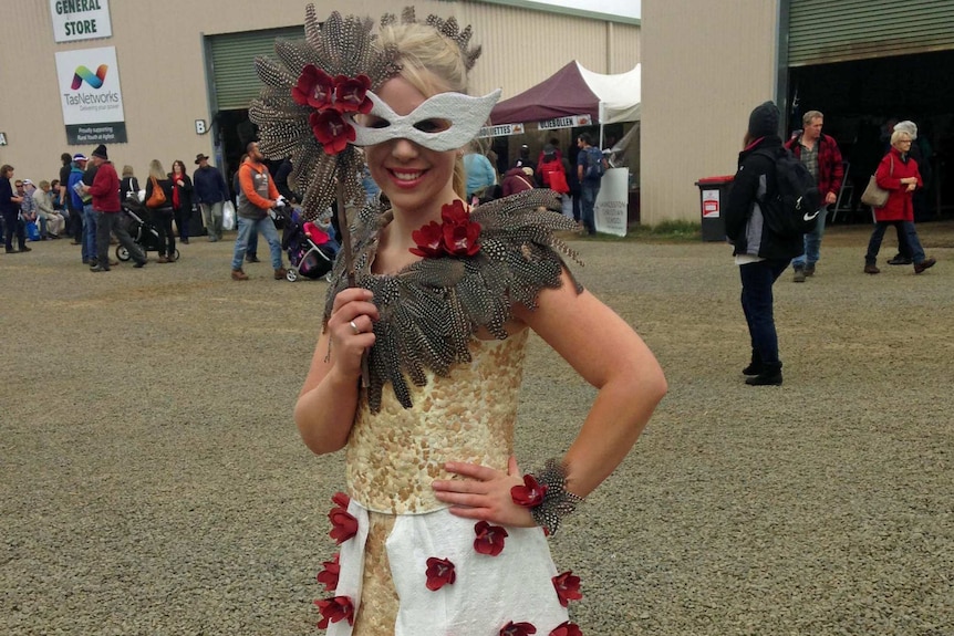 Brontie Birchall models a dress inspired by chickens at Agfest.