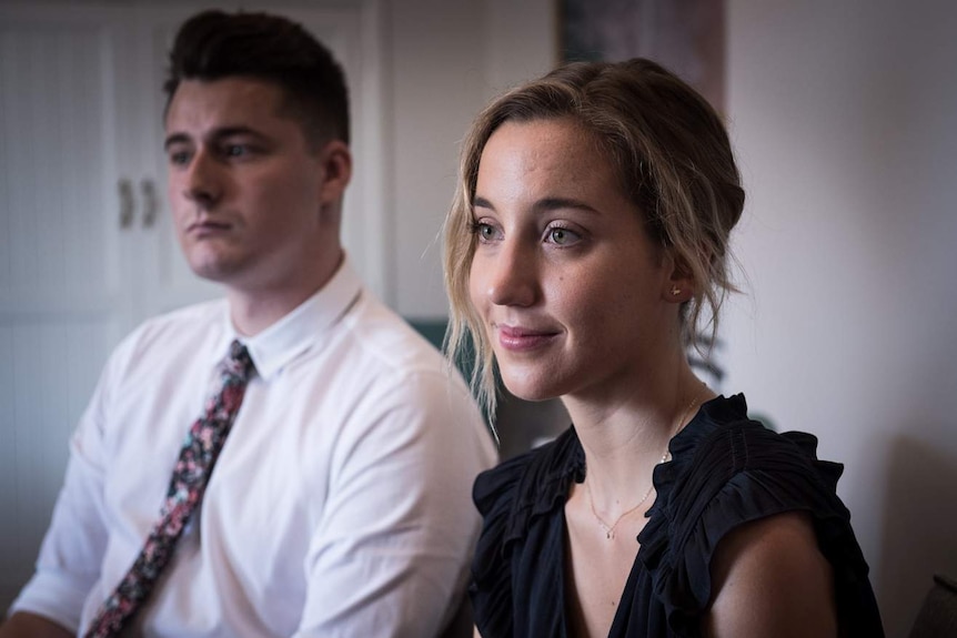 Austin Ward (left) and Hannah King both teaching school students sit together looking on at St Philip's Christian College.