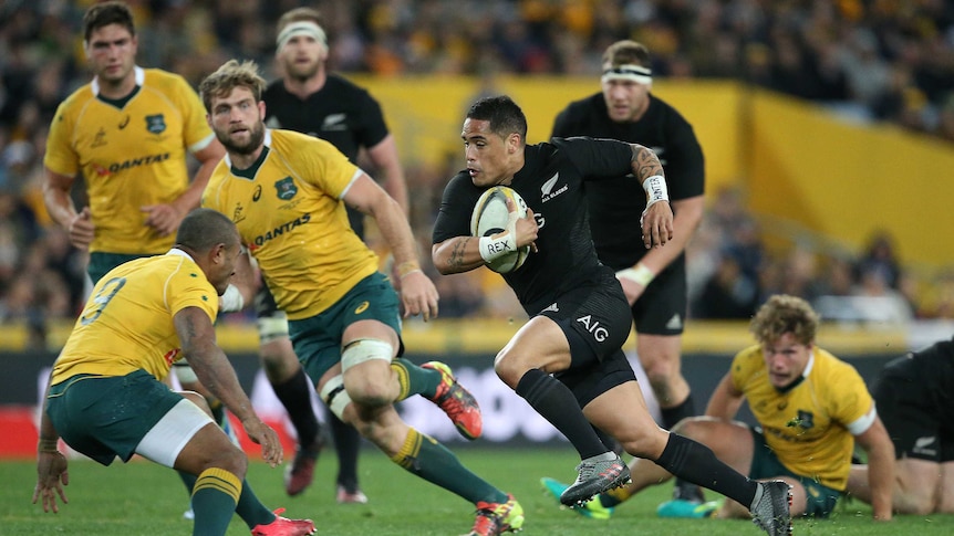 Aaron Smith of the All Blacks runs at the Wallabies defence